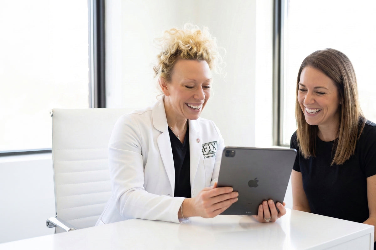 Dr. Beth Matre of Fix Studios Medspa in Cincinnati Mason OH Consults a patient