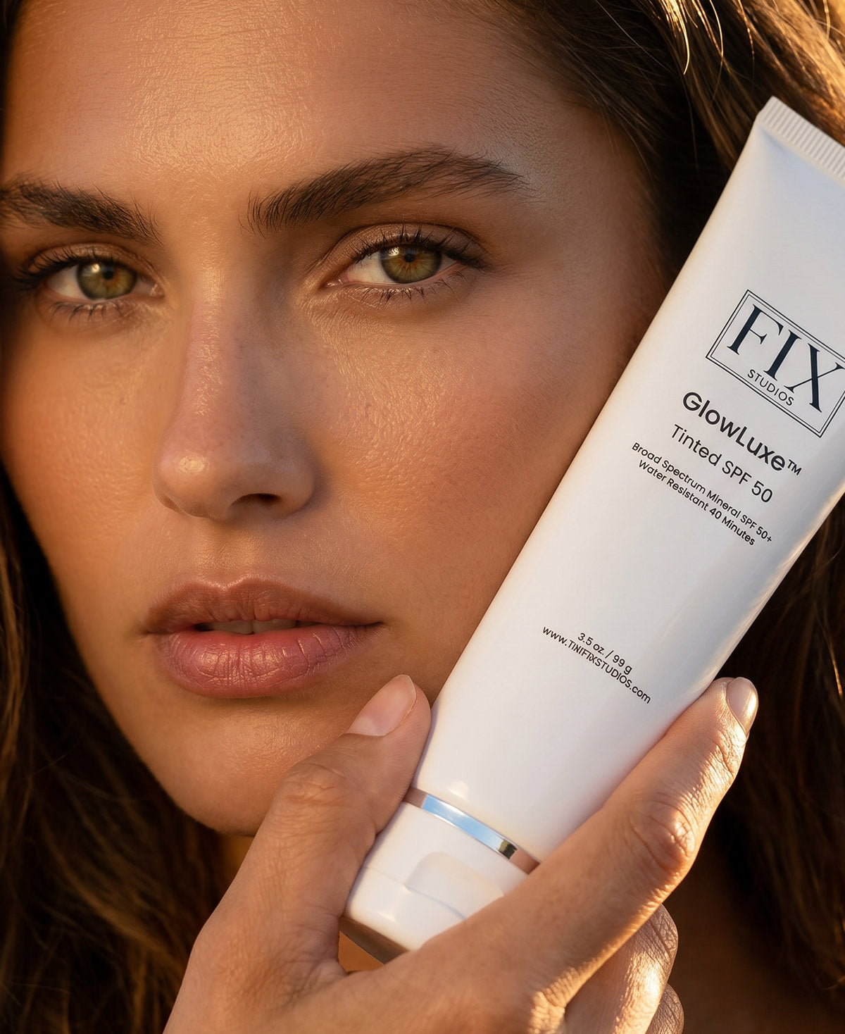 Close up of a woman's glowing skin after using Fix Studios medical-grade GlowLuxe™ Tinted SPF 50 sunscreen