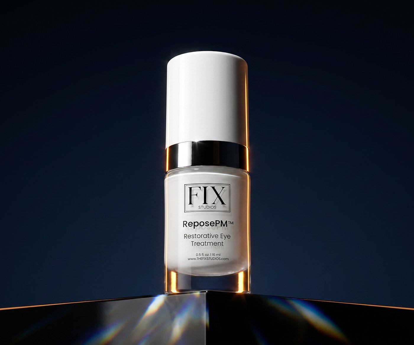 A bottle of Fix Studios Medical-Grade ReposePM™ Restorative Eye Treatment on a dark background with light reflections
