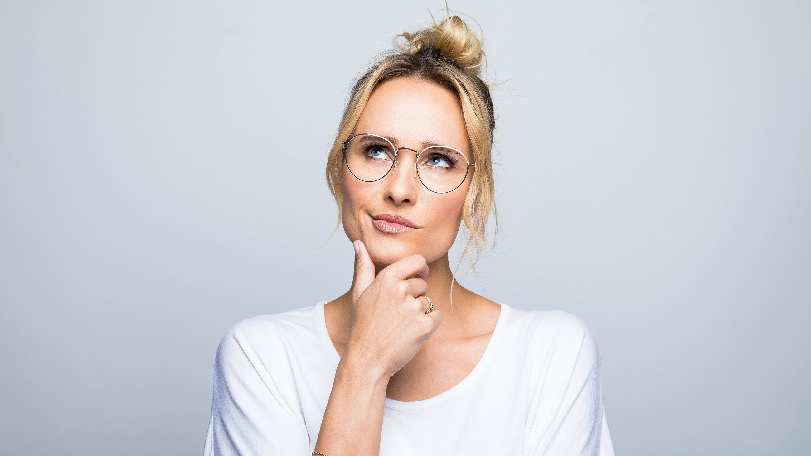 A woman thinking about choosing a medspa or dermatologist for botox and filler