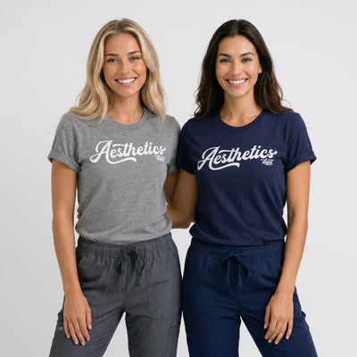 Two woman wear an Aesthetics Department t-shirt from Fix Studios for medspa professionals, injectors, and medspa fans