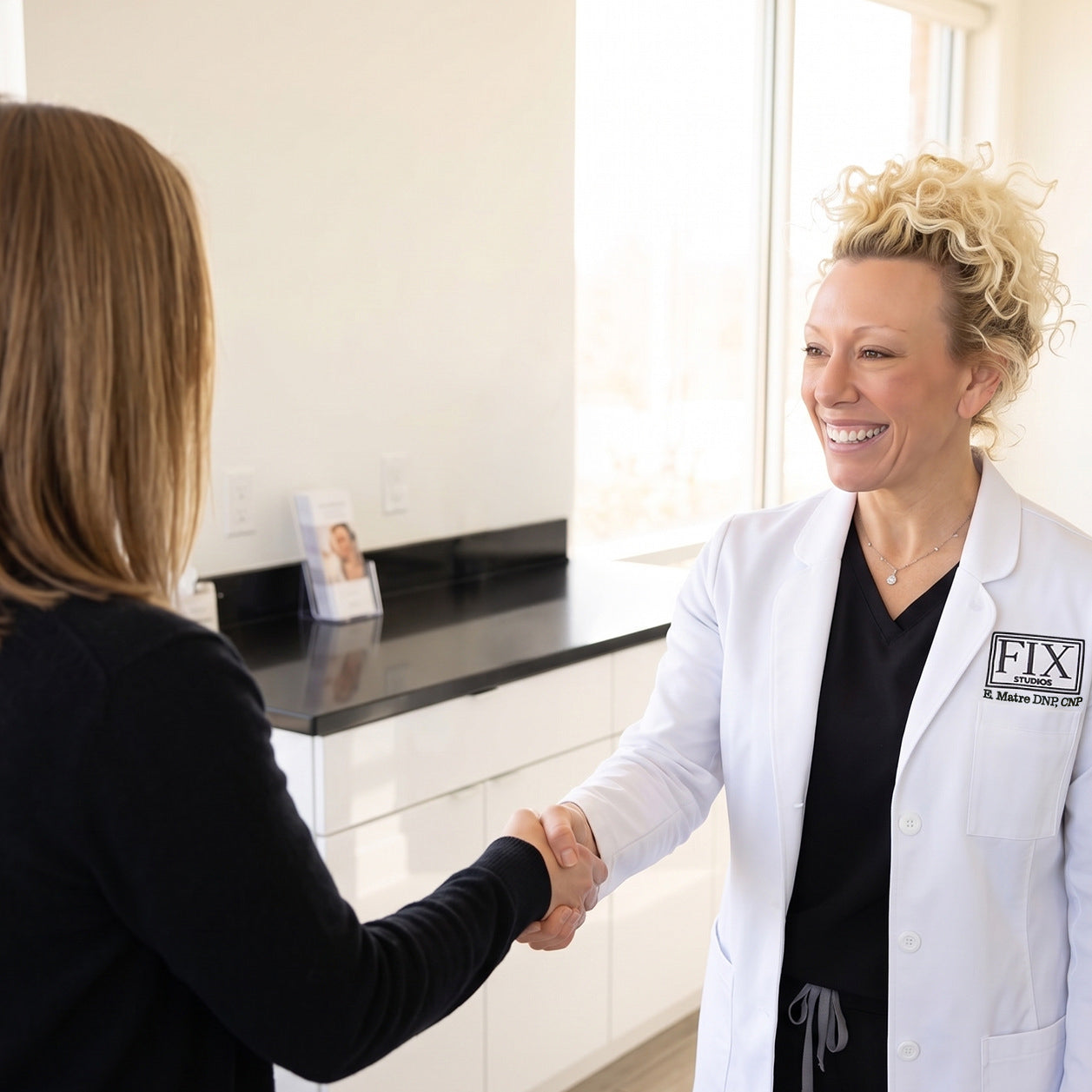 Elizabeth Matre DNP, CNP (aka Dr. Beth Matre) Greets a patient at fix studios medspa cincinnati mason OH