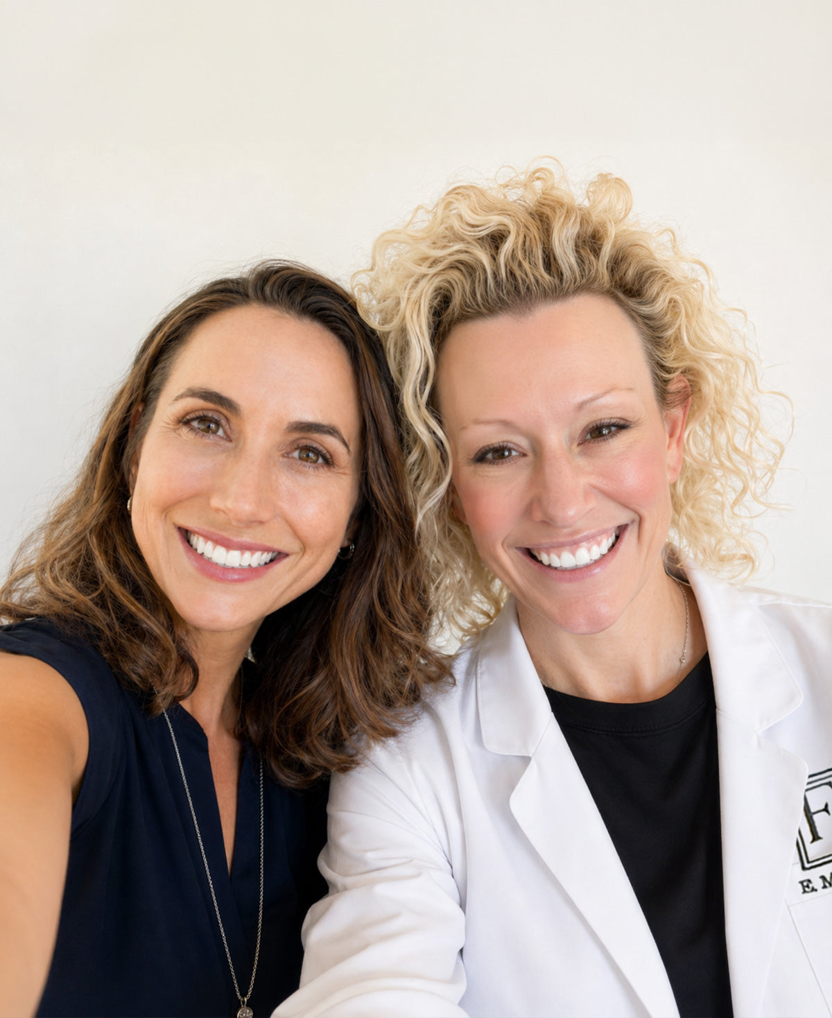 Dr. Beth Matre and a client pose together for a selfie at Fix Studios medspa Cincinnati Mason, OH