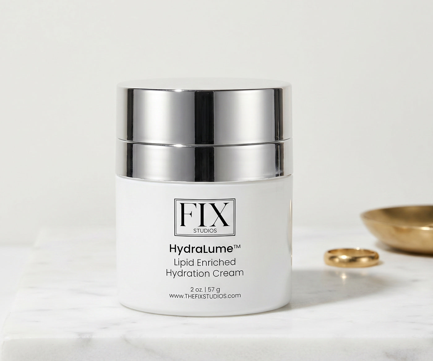 A jar of Fix Studios HydraLulme Lipid Enriched Hydration Cream medical-grade moisturizer on a white marble countertop
