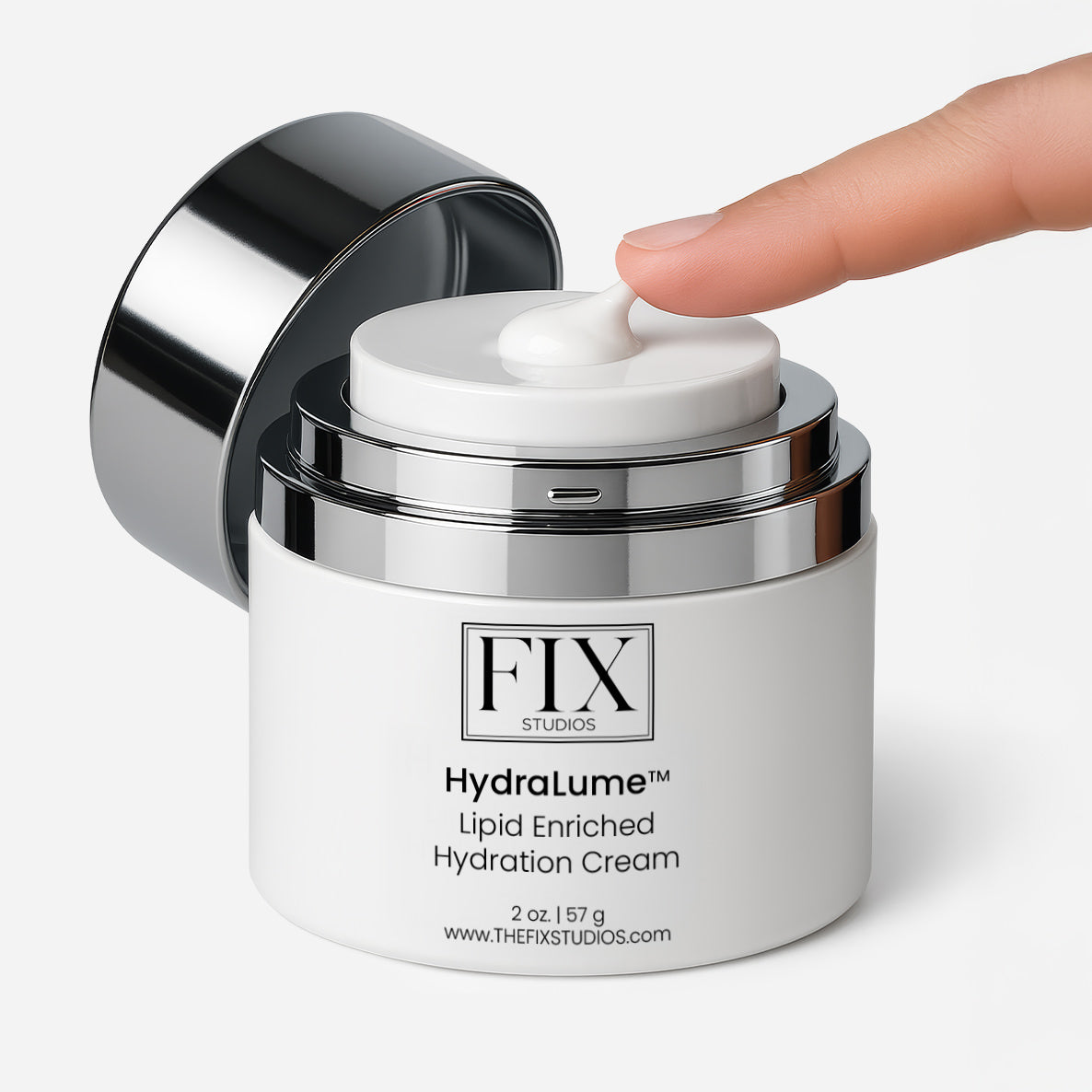 A finger uses the airless pump dispenser of Fix Studios HydraLume™ Lipid Enriched Hydration Cream medical-grade moisturizer