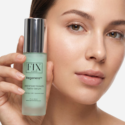 A woman holding a bottle of Regenera™ Advanced Growth Factor Serum - Medical-Grade anti-aging and recovery serum from Fix Studios